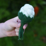 Papoose Toys felt cauliflower in a child's hand. 