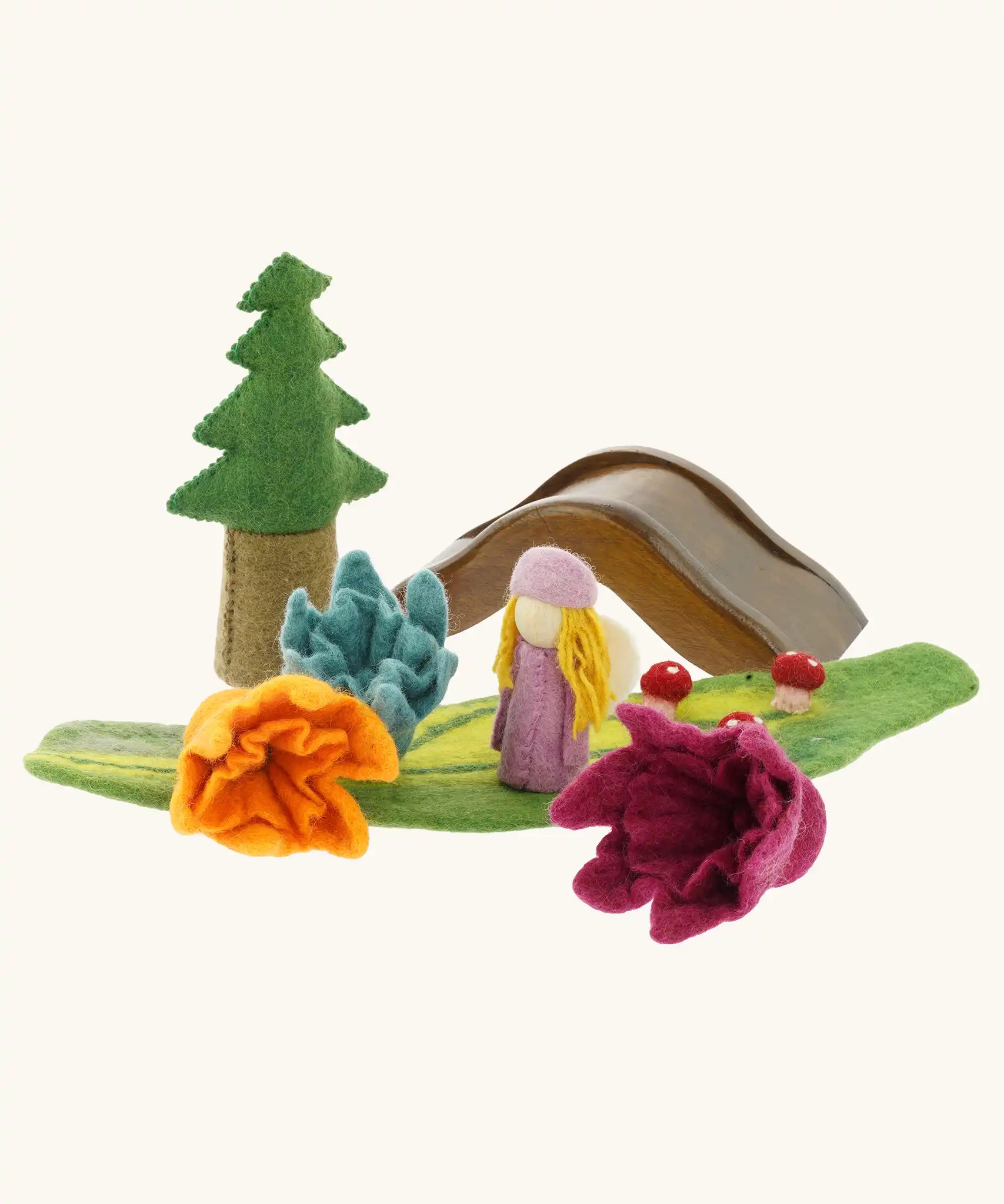 Papoose felted daffodil flowers used in a small world play scene with a wooden doll, tree and bridge in the background. 