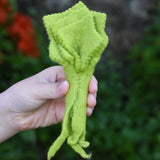 Papoose Toys felt lettuce in a child's hand.