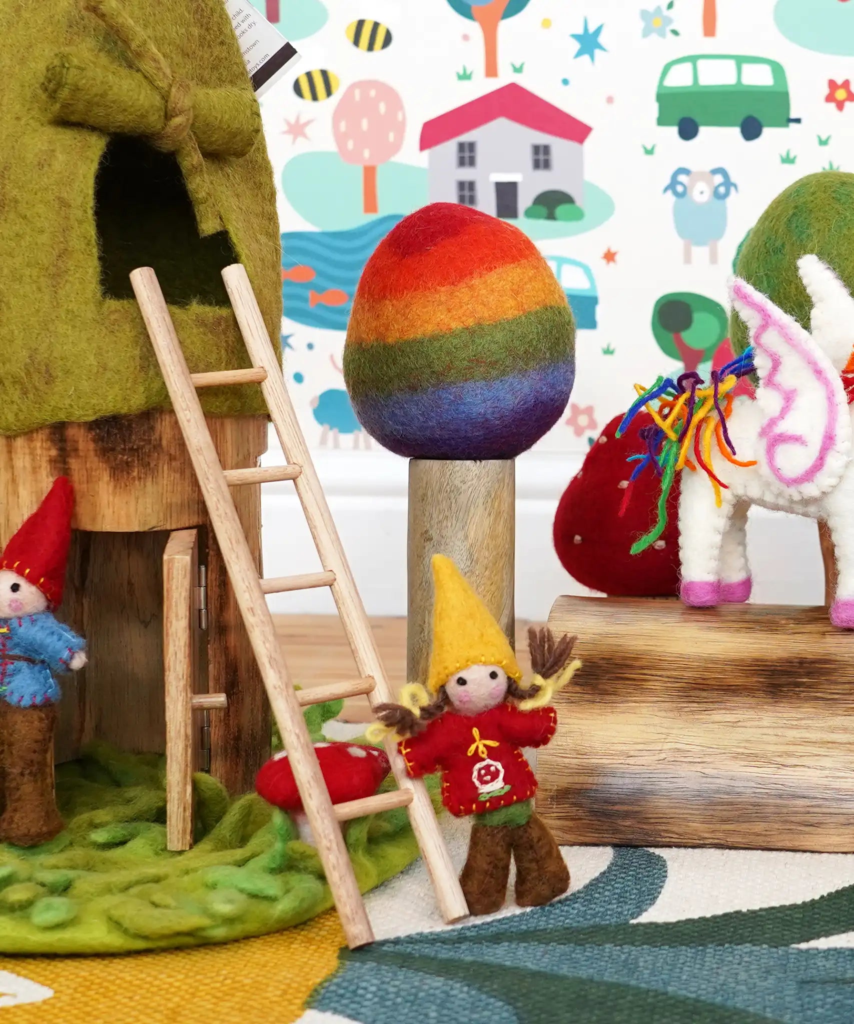 Papoose rainbow tree used in a small world play scene with other wooden and felted toys in the Babipur playroom.