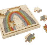 Pieces of the Papoose childrens earth rainbow jigsaw puzzle scattered around the wooden base on a white background
