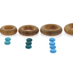 Papoose motessori wooden rings lined up in order of size next to some Grapat counters for number play