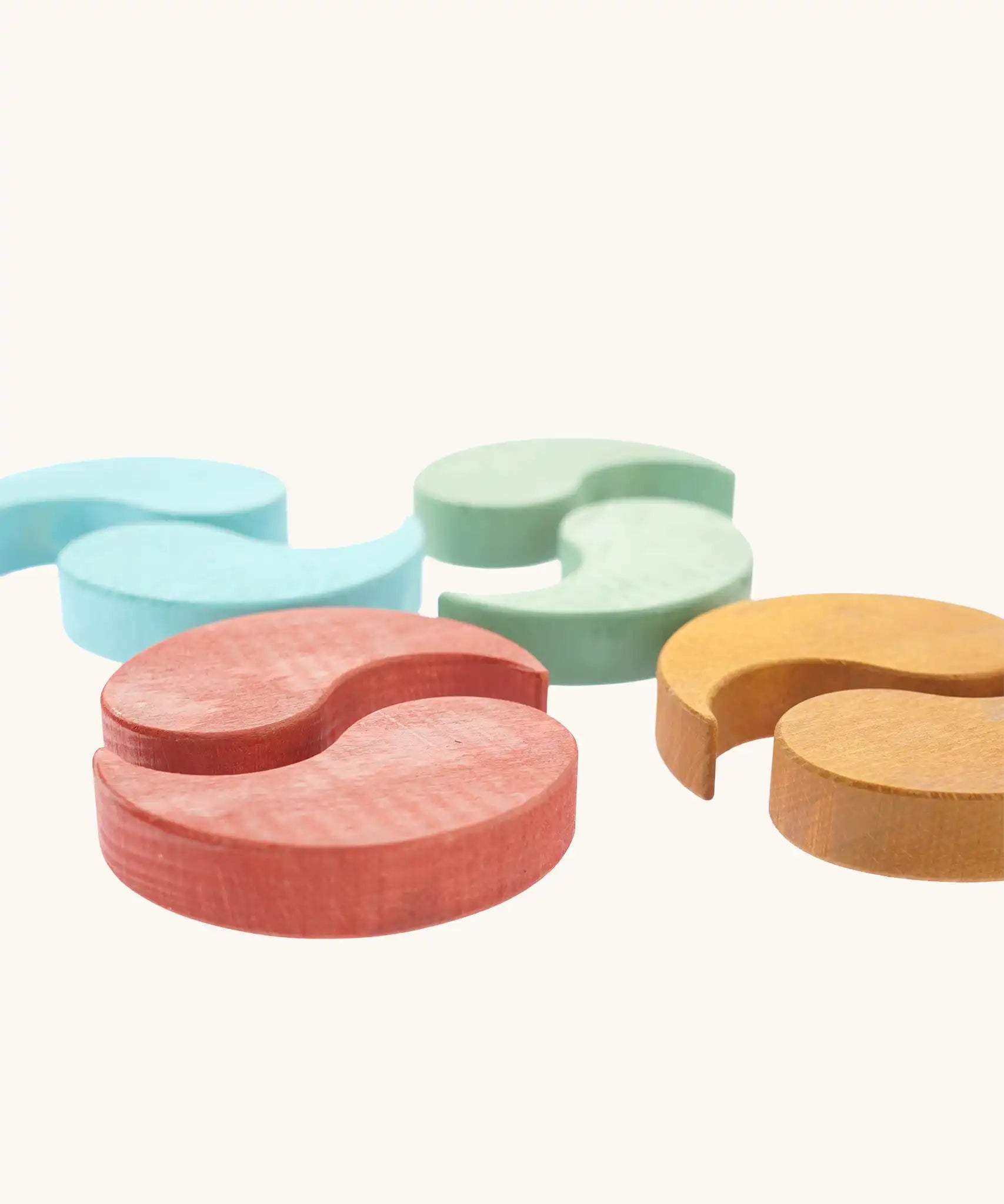 Papoose Toys wooden earth yim yams in blue, green, red and yellow