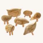 The Papoose Toys Mango Wood Pebble Animals Set on a plain background