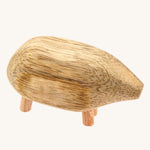 An animal form the Papoose Toys Mango Wood Pebble Animals Set on a plain background. 
