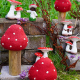 Papoose Toys felt toadstool wooden toy set used in a small world play scene with other toadstool and mushroom themed toys in the Babipur garden.