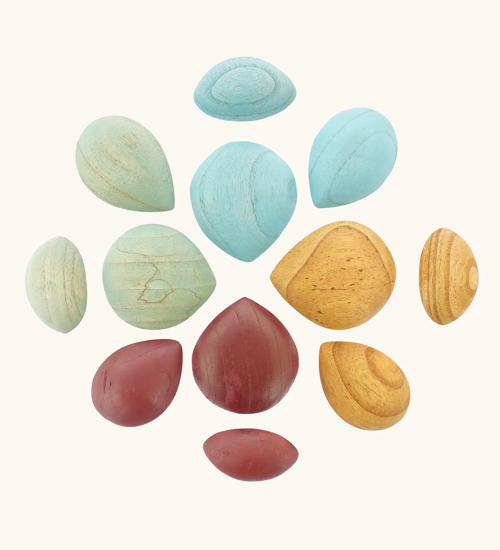 Papoose Toys earth wooden pebbles placed in a mandala shape.