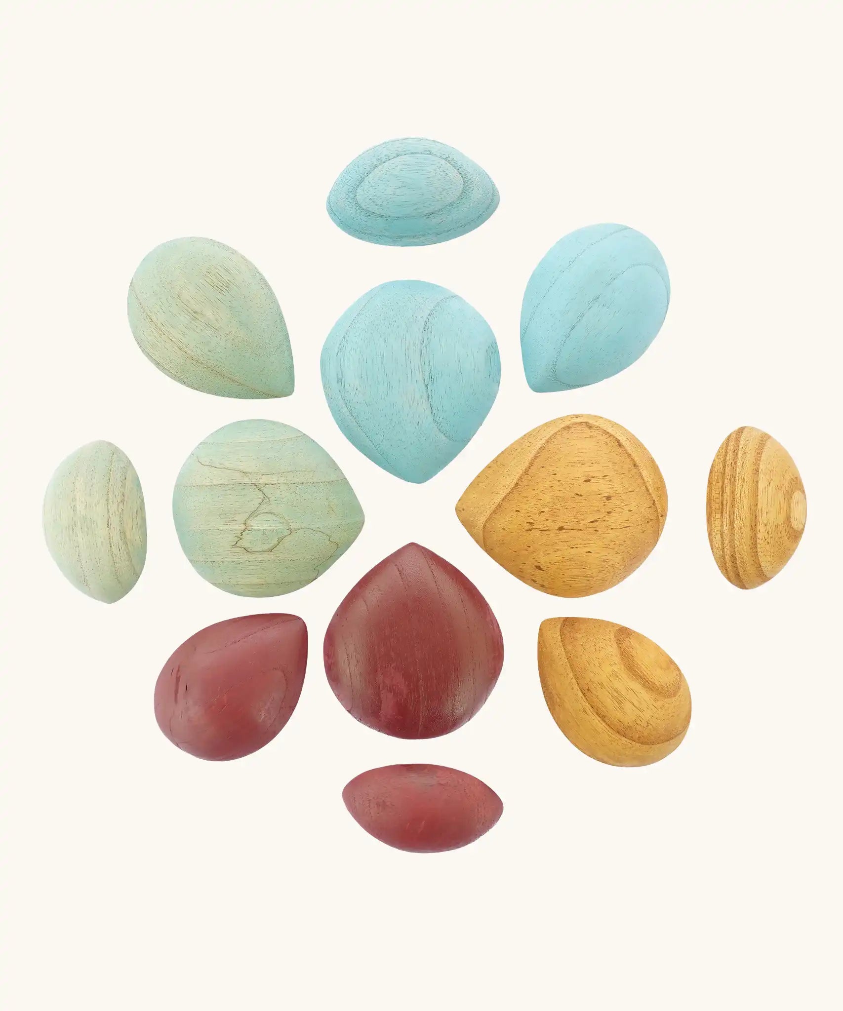 Papoose Toys earth wooden pebbles placed in a mandala shape.