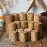 Papoose Toys wooden stacking trunks placed on a wooden desk.
