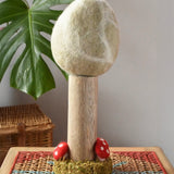 Papoose Toys Winter felt woodland tree placed on a rattan top stool. 