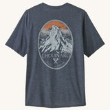 The Patagonia Men's Capilene Cool Daily Graphic Shirt - Chouinard Crest / Smolder Blue X-Dye on a plain background.