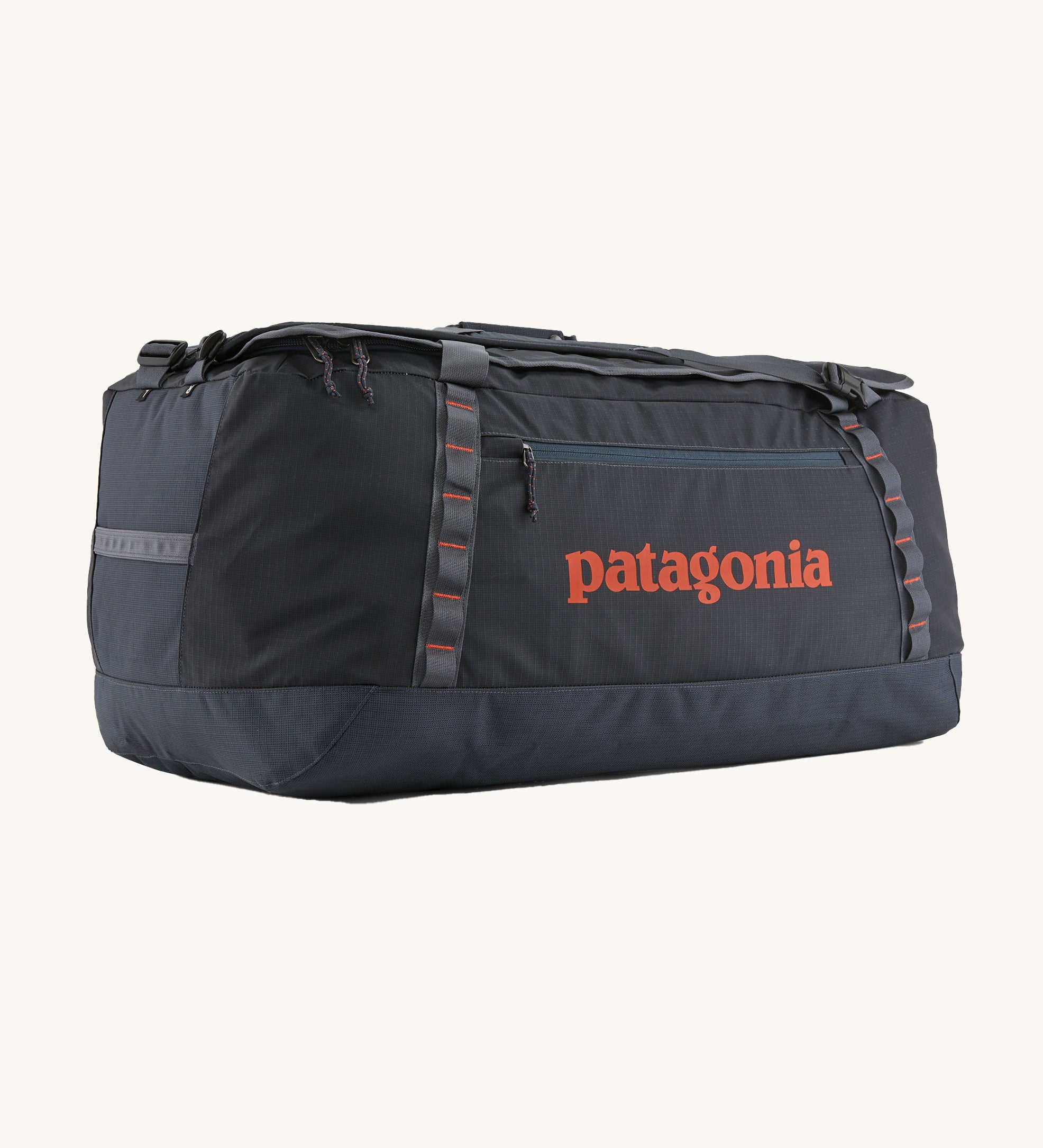 Patagonia 100 litres duffel bag in a navy blue colour on a cream background.