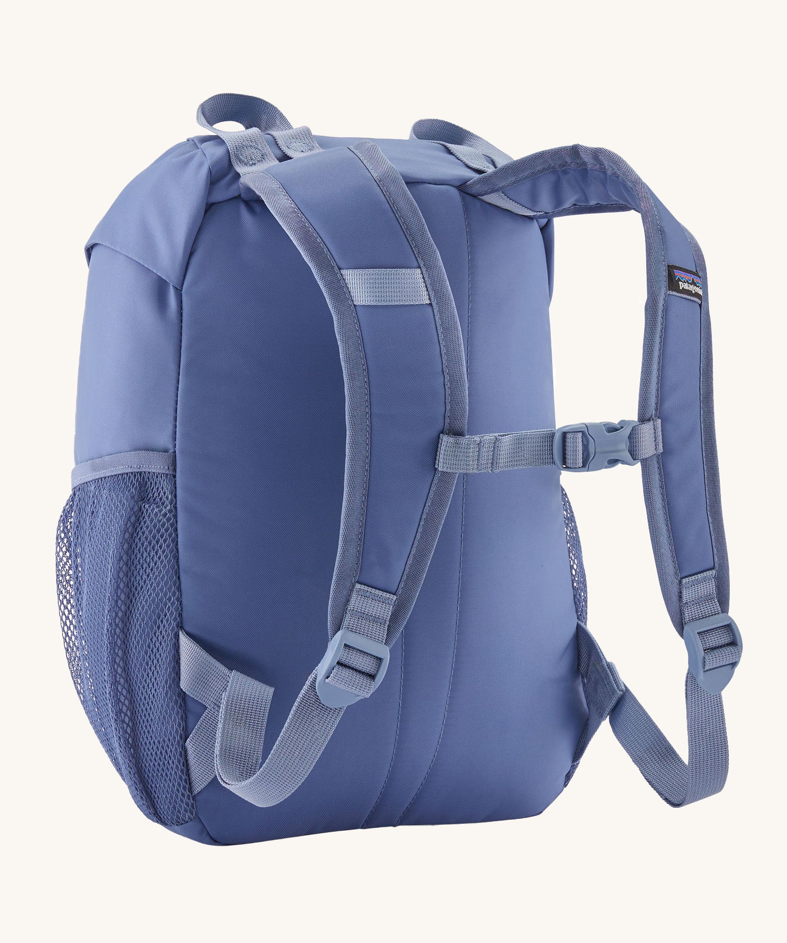 A reverse image of the The Patagonia Kids Refugito 12L Backpack  in current blue showing the padded shoulder straps and matching chest straw detail