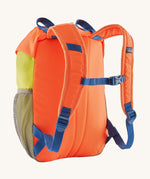 A reverse image of the The Patagonia Kids Refugito 12L Backpack  in orange peel showing the padded shoulder straps and blue chest straw detail