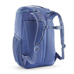 The back of the Patagonia refugito 18 litres daypack in current blue. showing the pastel blue padded shoulder pads with blue detail and mesh side pockets on 100% recycled material 