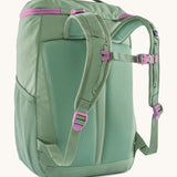 The back of the Patagonia refugito 18 litres daypack in ellwood green. showing the pastel green padded shoulder pads with pink detail and mesh side pockets on 100% recycled material 