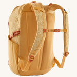 Patagonia 30L yellow refugio day backpack with a flower design  back detail