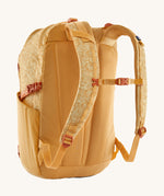 Patagonia 30L yellow refugio day backpack with a flower design  back detail