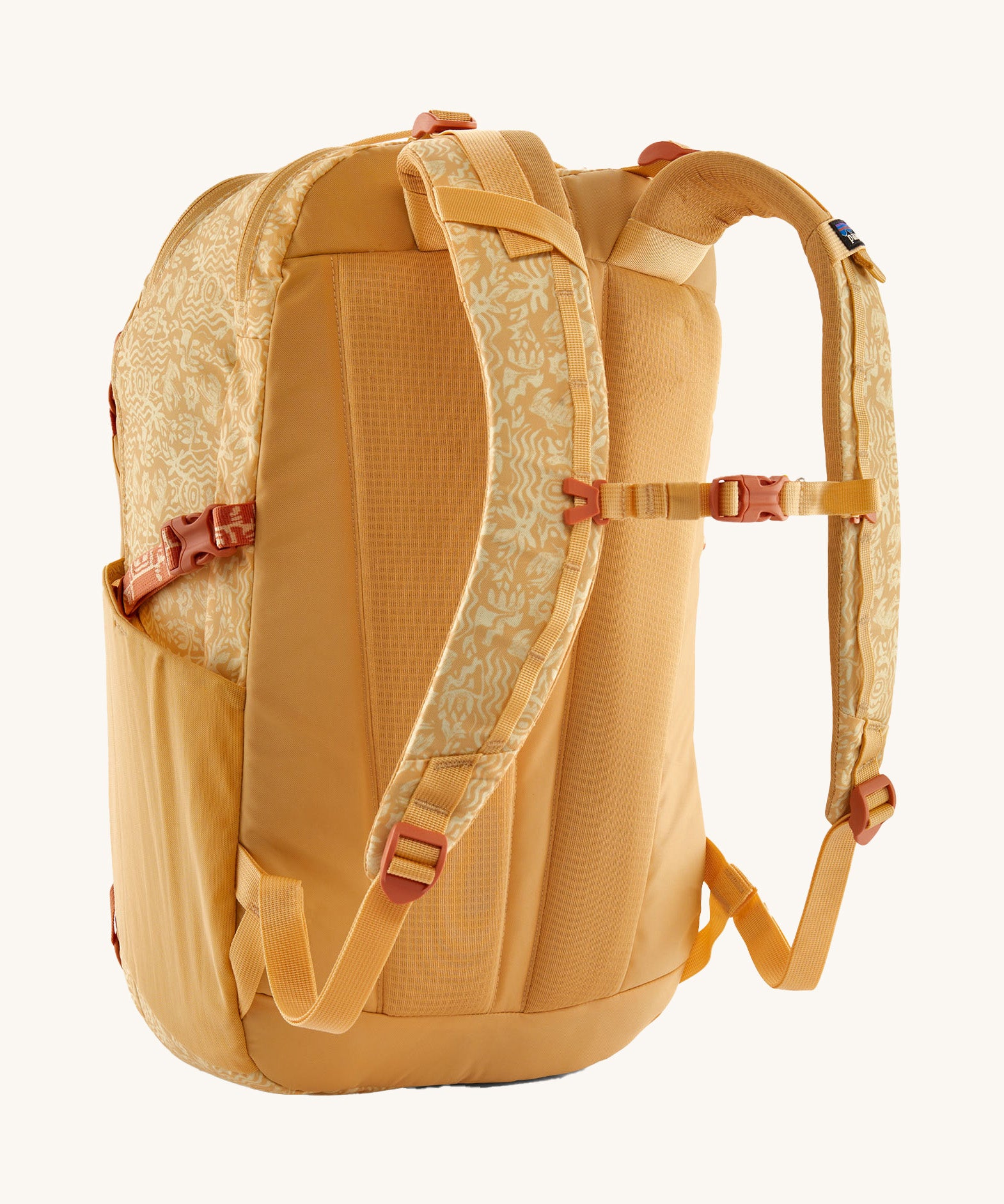 Patagonia 30L yellow refugio day backpack with a flower design  back detail