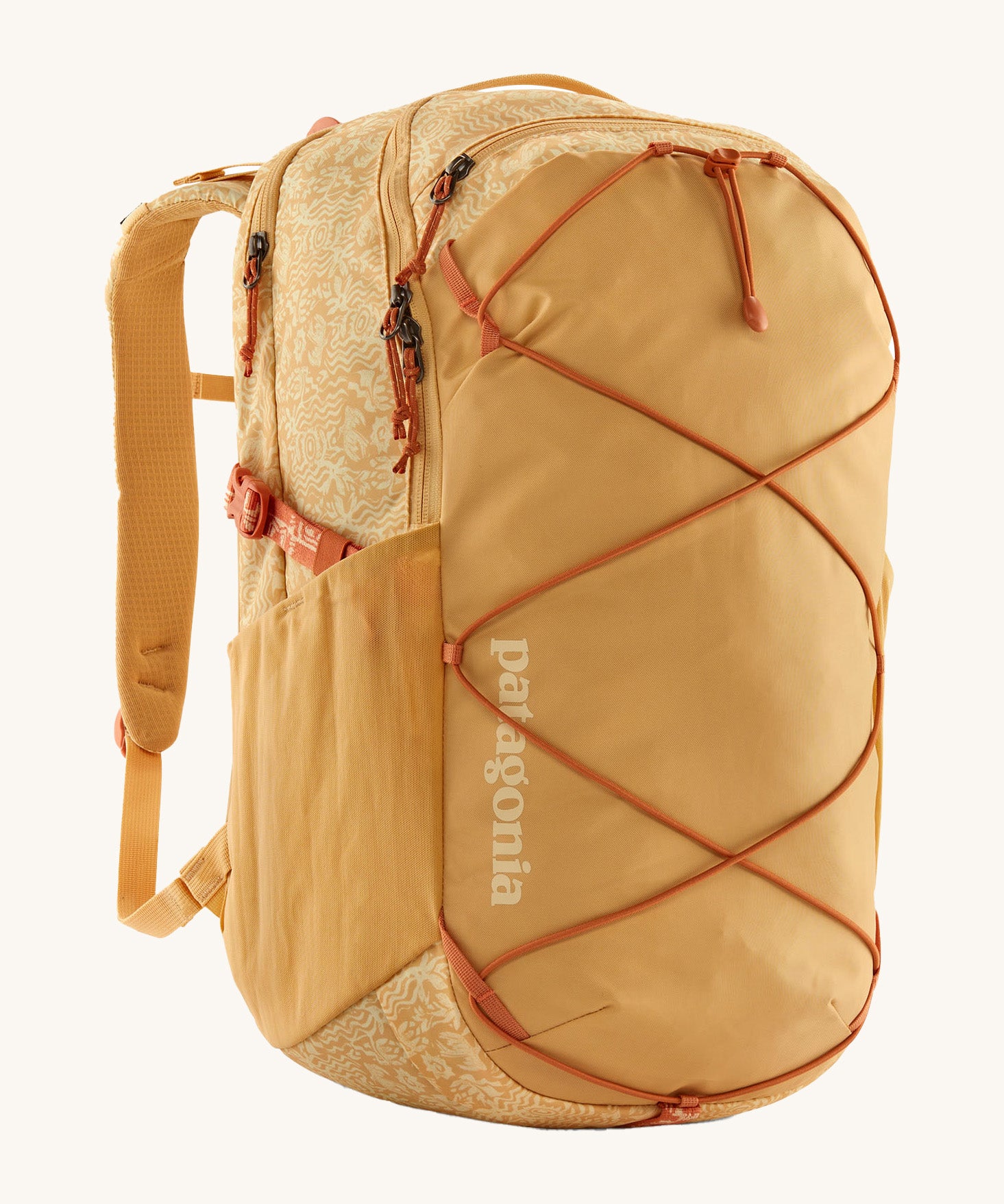 Patagonia 30L yellow refugio day backpack with a flower design on a cream background.