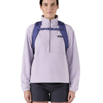 Patagonia 30L purple refugio day backpack worn by an adult shoulder strap and clip detail