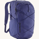 Patagonia 30L purple refugio day backpack on a cream background.