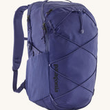 Patagonia 30L purple refugio day backpack on a cream background.