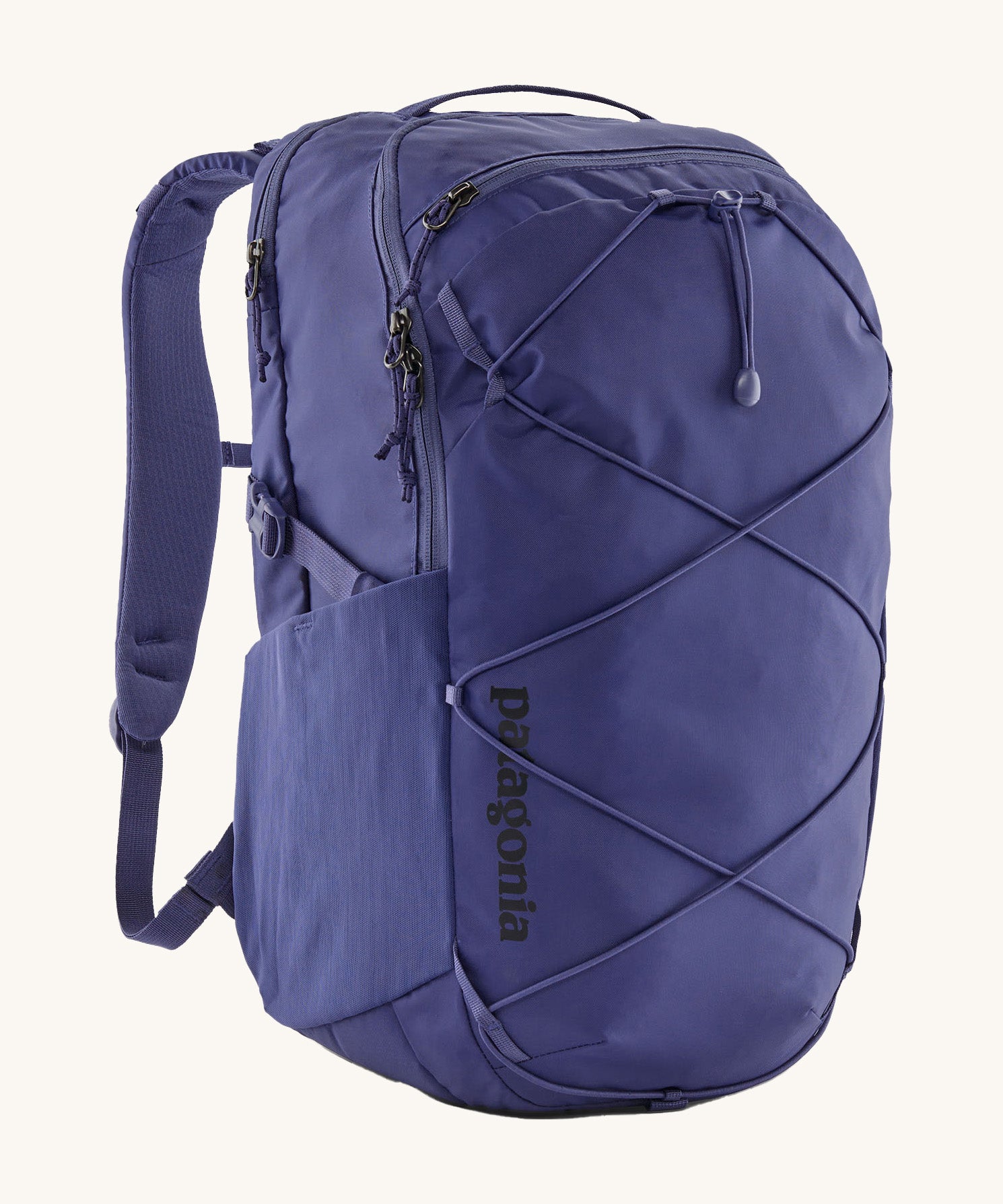 Patagonia 30L purple refugio day backpack on a cream background.