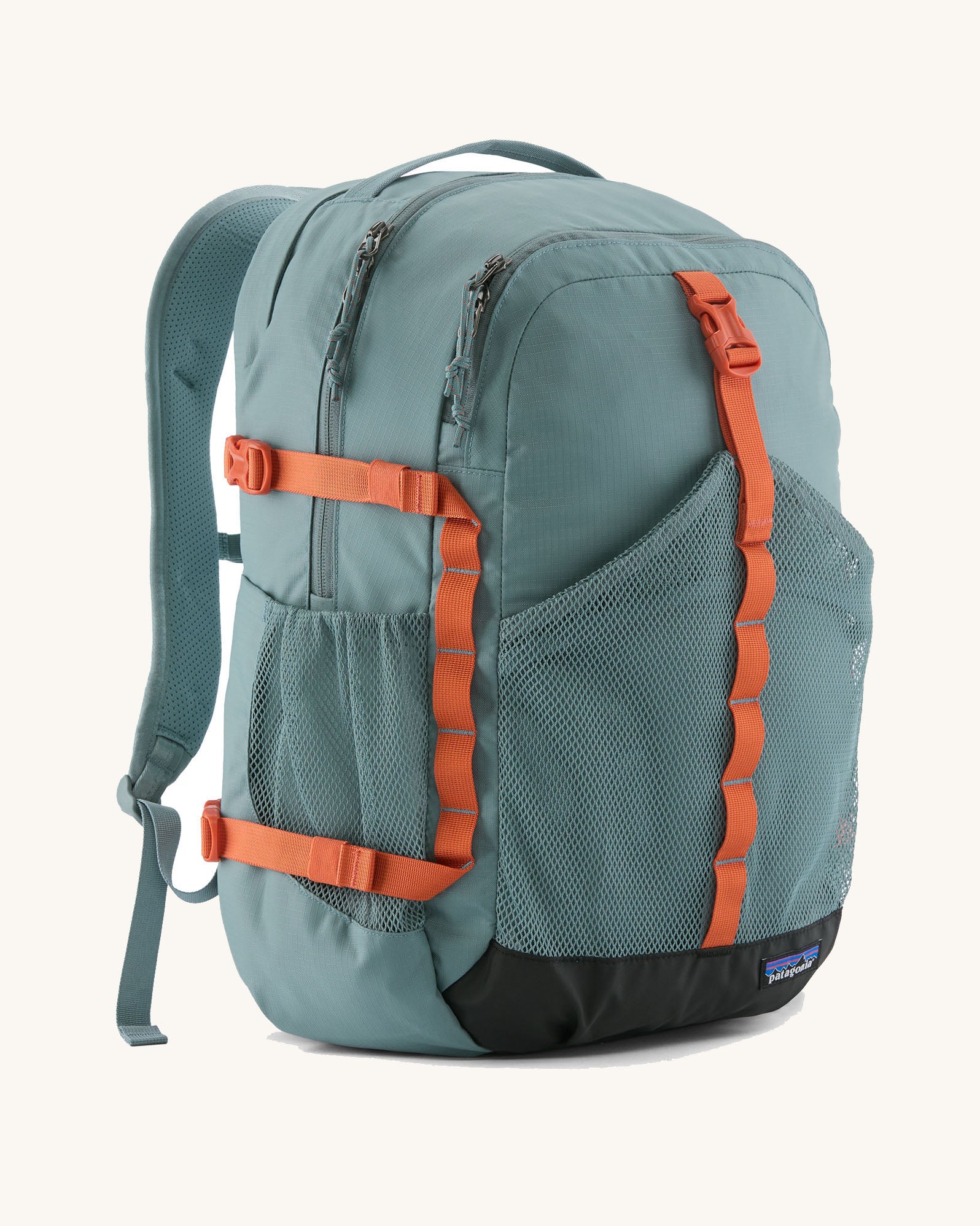 Patagonia 30L refugio backpack in blue sage with side bottle holder and orange gear loops and quick release buckles.