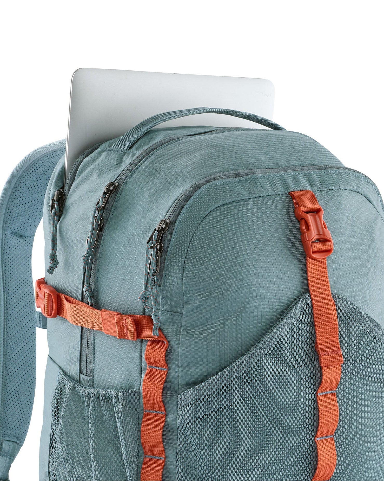 Laptop sleeve in the Patagonia 30L refugio backpack in blue sage with side bottle holder and orange gear loops and buckles.