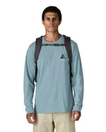 Patagonia 30L refugio backpack in smolder blue with black chest strap and quick release buckles.