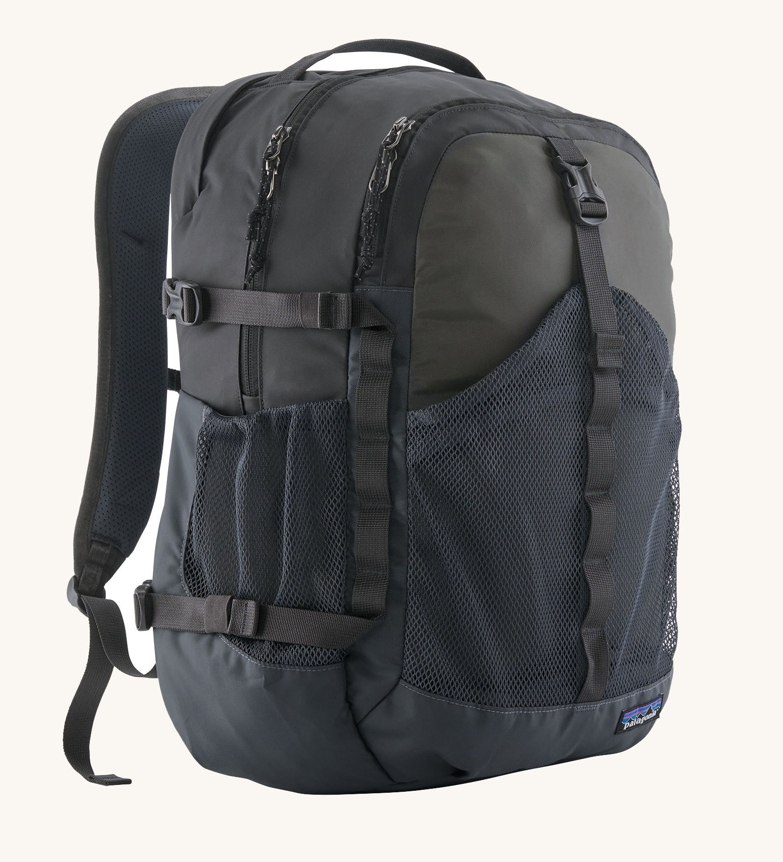 Patagonia 30L refugio backpack in smolder blue with side bottle holder and black gear loops and quick release buckles.