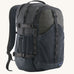 Patagonia 30L refugio backpack in smolder blue with side bottle holder and black gear loops and quick release buckles.