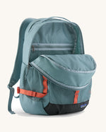 Patagonia 30L refugio backpack in blue sage with zipped compartments and orange gear loops and quick release buckles.