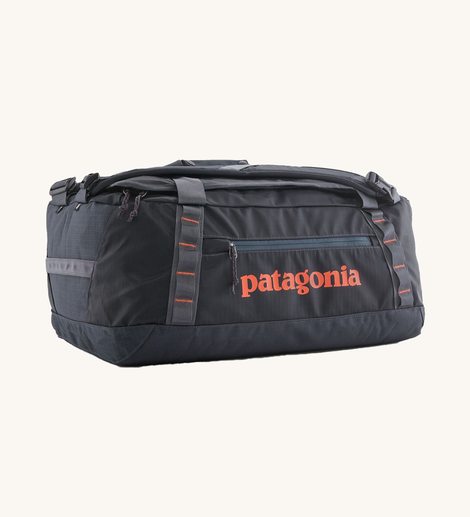 Patagonia 40 litres duffel bag in a dark navy blue colour on a cream background.