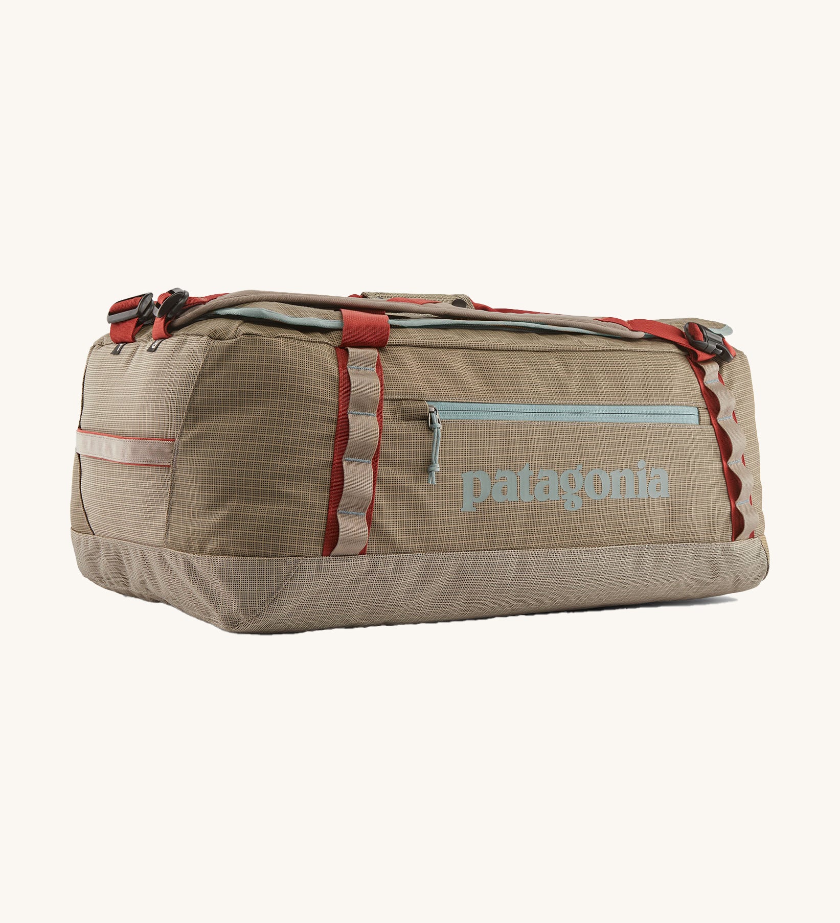 Patagonia 55 litres duffel bag in a seabird grey colour on a cream background.