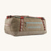 Patagonia 55 litres duffel bag in a seabird grey colour on a cream background.