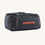 Patagonia 55 litres duffel bag in a navy blue colour on a cream background.
