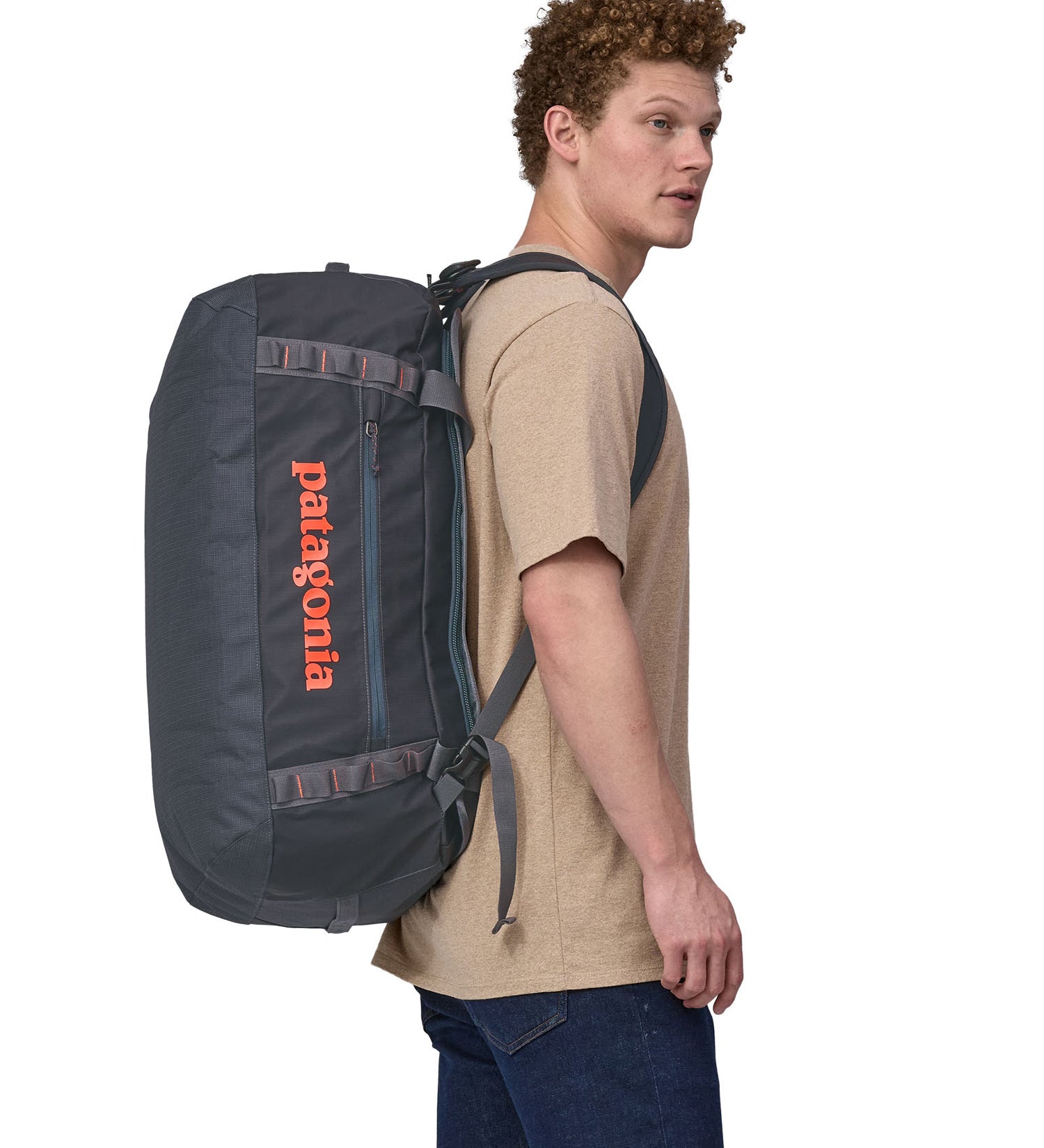 Patagonia 55 litres duffel bag in a navy blue colour being carried by an adult