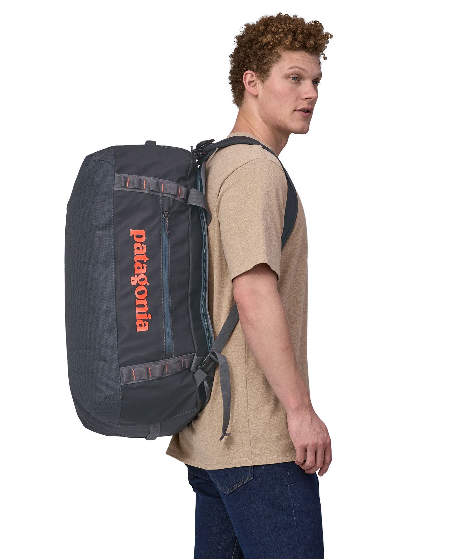 Patagonia 55 litres duffel bag in a navy blue colour being carried by an adult