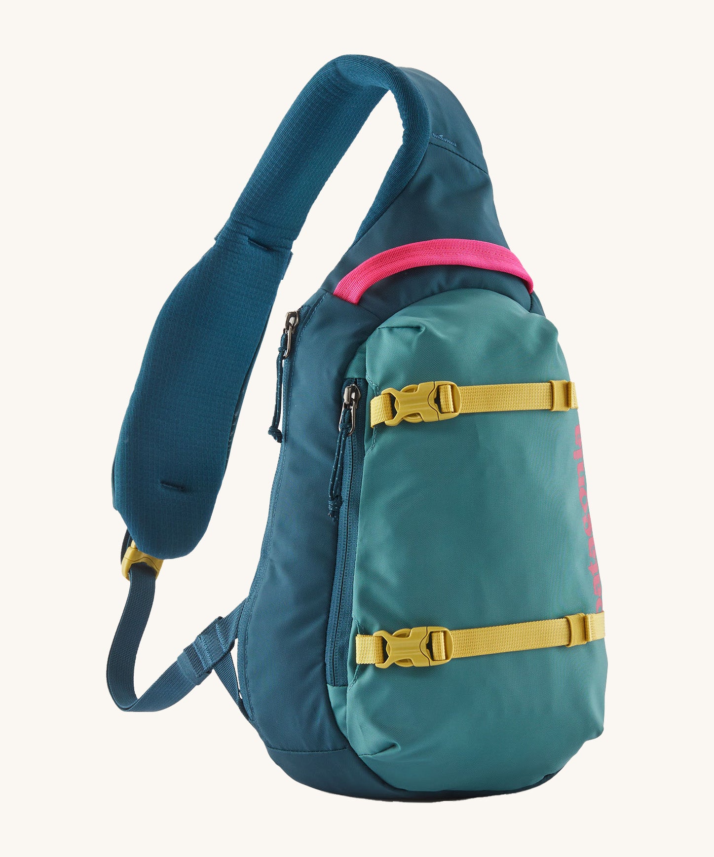 Patagonia 8L atom sling bag in a turquoise colour on a cream background.