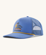 Patagonia broadcaster cap in blue colour on a cream background.