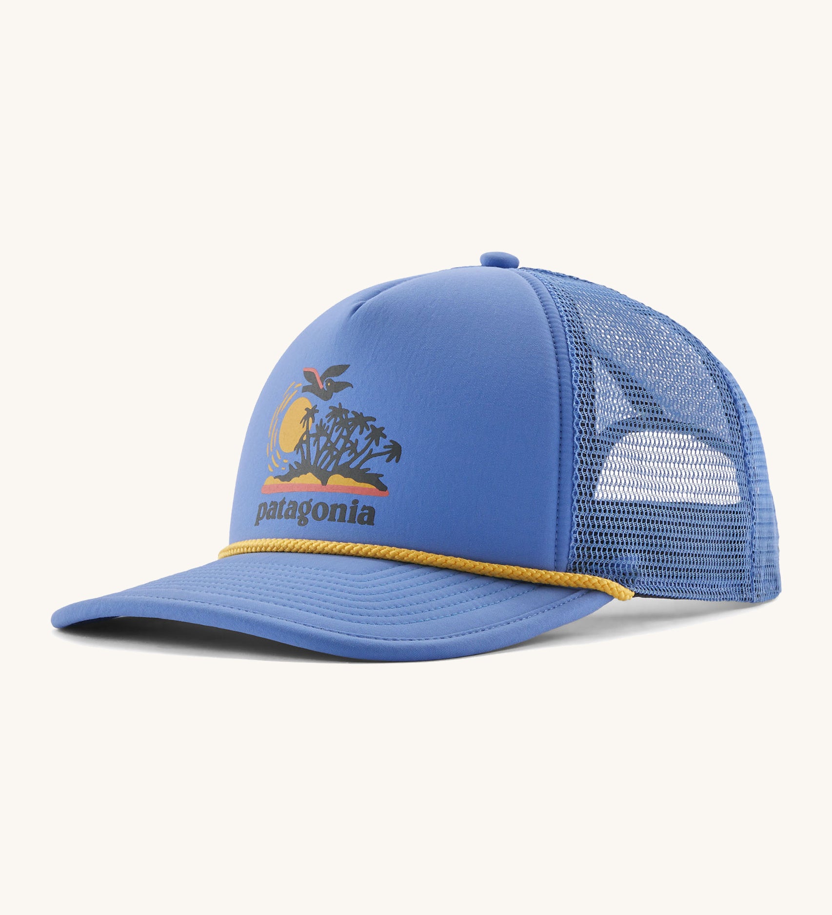 Patagonia broadcaster cap in blue colour on a cream background.
