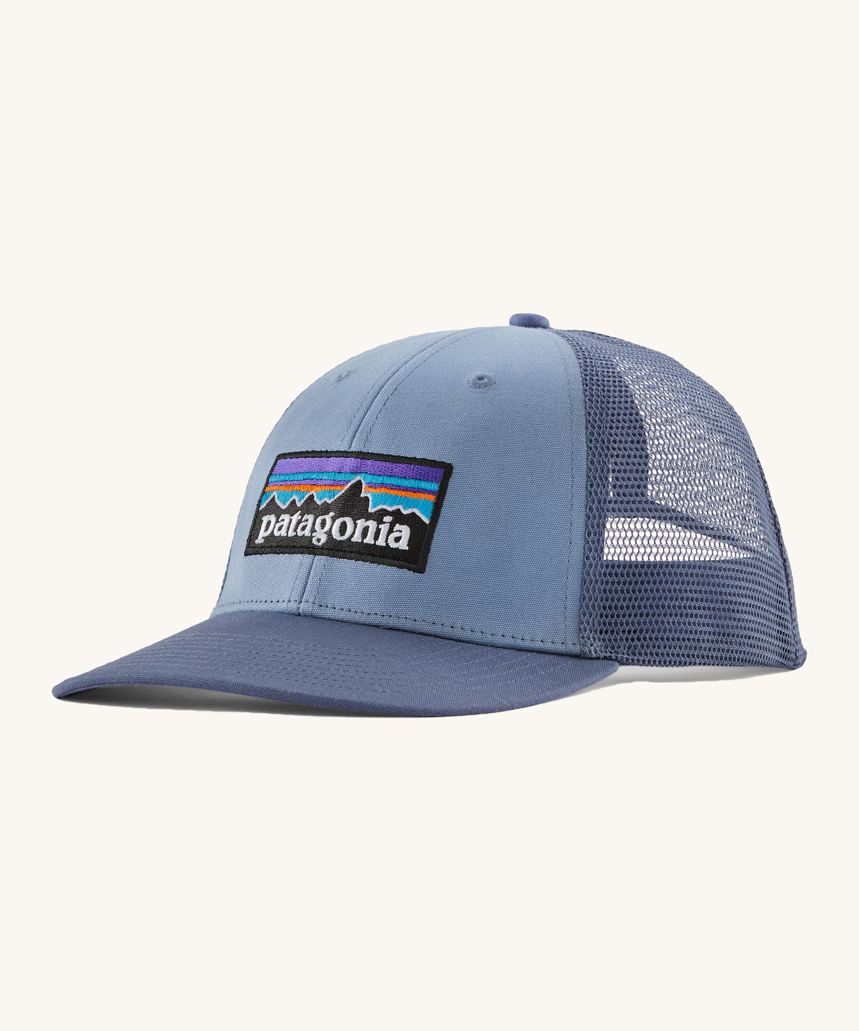 Patagonia adult barnacle blue hat. A trucker style cap with a low profile in blue and features a navy mesh back with a logo embroidery on the front panel