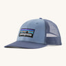 Patagonia adult barnacle blue hat. A trucker style cap with a low profile in blue and features a navy mesh back with a logo embroidery on the front panel
