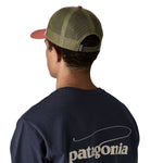 The back of a man wearing the A man wearing the Patagonia adult birch white hat available at Babipur.