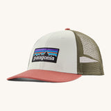 Patagonia adult birch white hat. A trucker style cap with a low profile in white colour and features a khaki mesh back with a coral brim and logo embroidery on the front panel