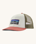 Patagonia adult birch white hat. A trucker style cap with a low profile in white colour and features a khaki mesh back with a coral brim and logo embroidery on the front panel