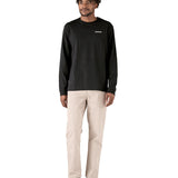 Full view of the black cotton Patagonia Adult  L/S P-6 Logo Responsibili-Tee worn by an adult