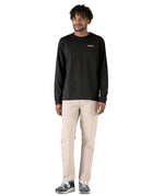 Full view of the black cotton Patagonia Adult  L/S P-6 Logo Responsibili-Tee worn by an adult